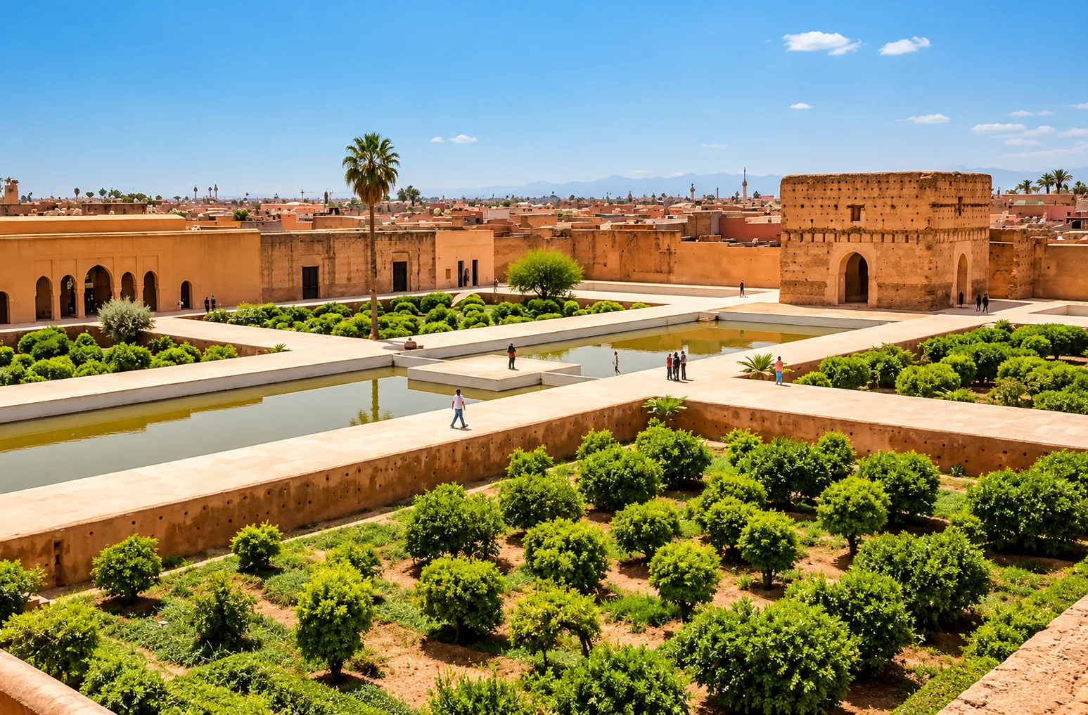 Sunken gardens and long pools inside the El Badi Palace ruins seen from above, Marrakech guided tour