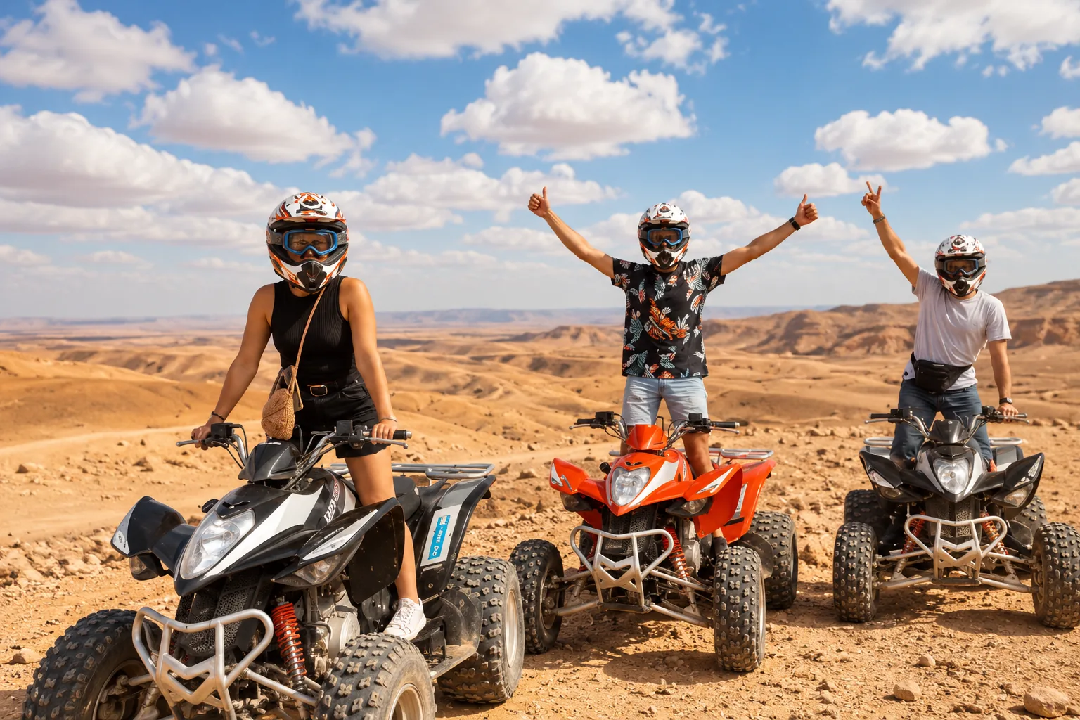 Friends cheering beside their quads on a rocky ridge while quad biking in the Agafay desert under a bright sky